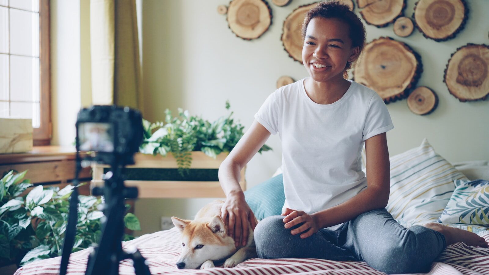 Woman records a video with her dog.